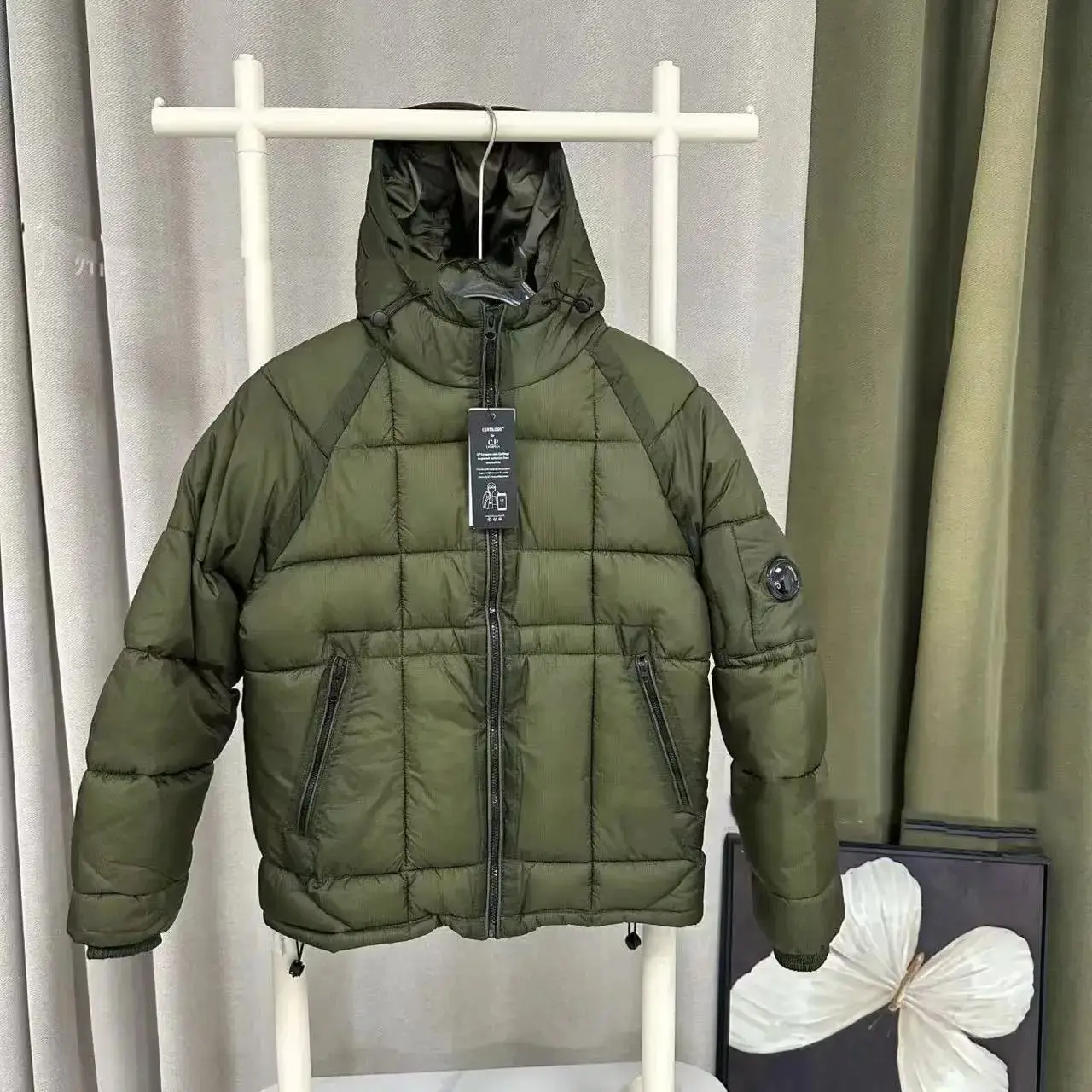 A down jacket - olive green